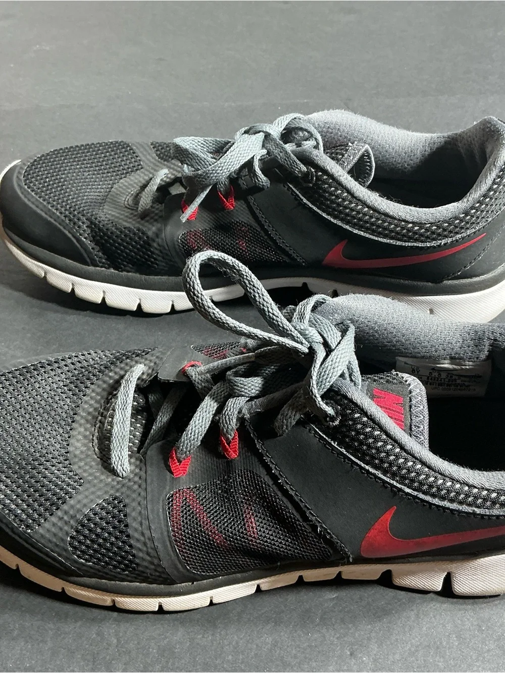 Youth black Athletic Sneakers with Red Accents
